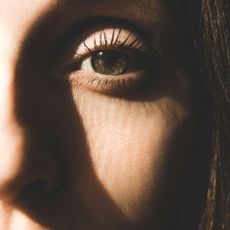 Woman with sun shining on her skin