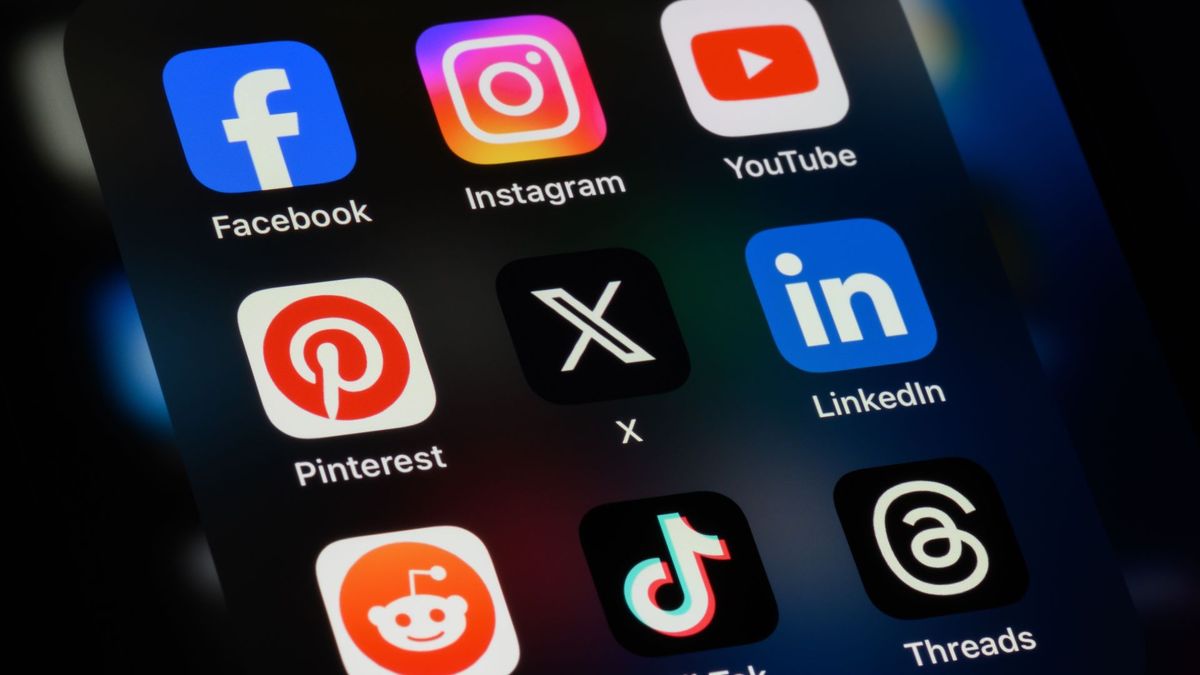 Facebook, Instagram, YouTube, Pinterest, X, LinkedIn, Reddit, TikTok, Threads apps on an iPhone