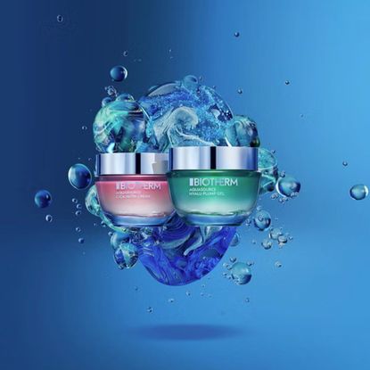 Blue background with two Biotherm AquaSource products and water splash effect