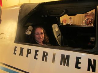 SPACE.com reporter Clara Moskowitz sits inside a mockup of the XCOR Lynx suborbital spaceship.