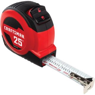 red tape measure with fraction markings