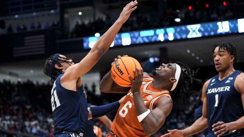 Dante Maddox Jr. #21 of the Xavier Musketeers and Arthur Kaluma #6 of the Texas Longhorns compete for the ball in March 2025