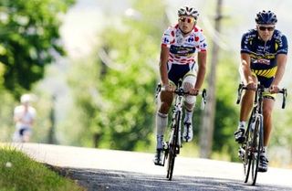 Dutch rider Johnny Hoogerland wears the polka dot jersey while cycling with his father Cees near Aurillac, on the first rest day of the Tour de France cycling race, in Aurillac, southern France.