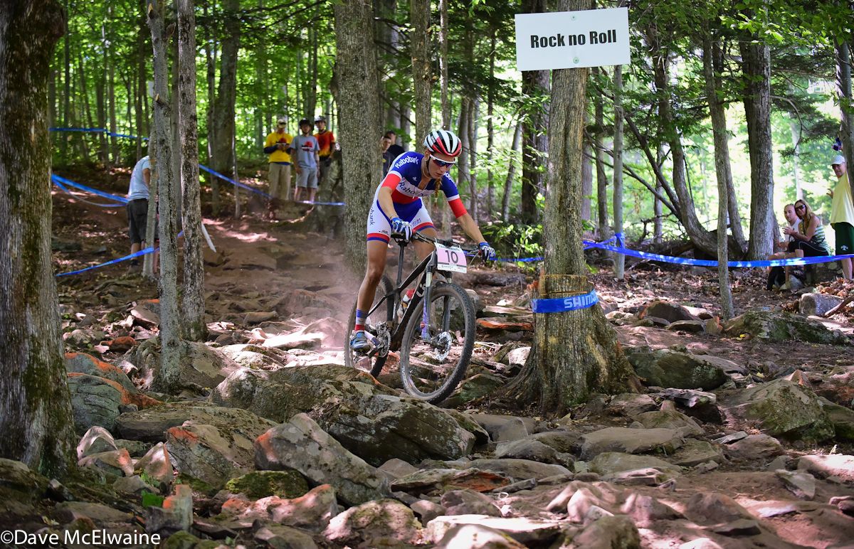 Pauline Ferrand Prevot (Raboliv) descending through a big rock garden on lap three