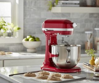KitchenAid bowl lift stand mixer in red on a countertop where cookies are being made