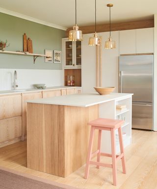 White, wood, and pastel green kitchen