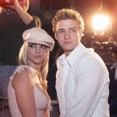 britney spears and boyfriend justin timberlake arrive at the premiere of her movie crossroads at the mann chinese theatre in hollywood, ca, feb 11, 2002 photo by kevin wintergetty images