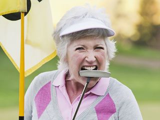 Lady biting putter in anger