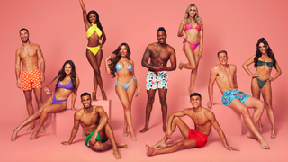 Love Island 2023 contestants posing against coral-coloured studio backdrop to promote season 9 of the most-watched dating show on UK television.