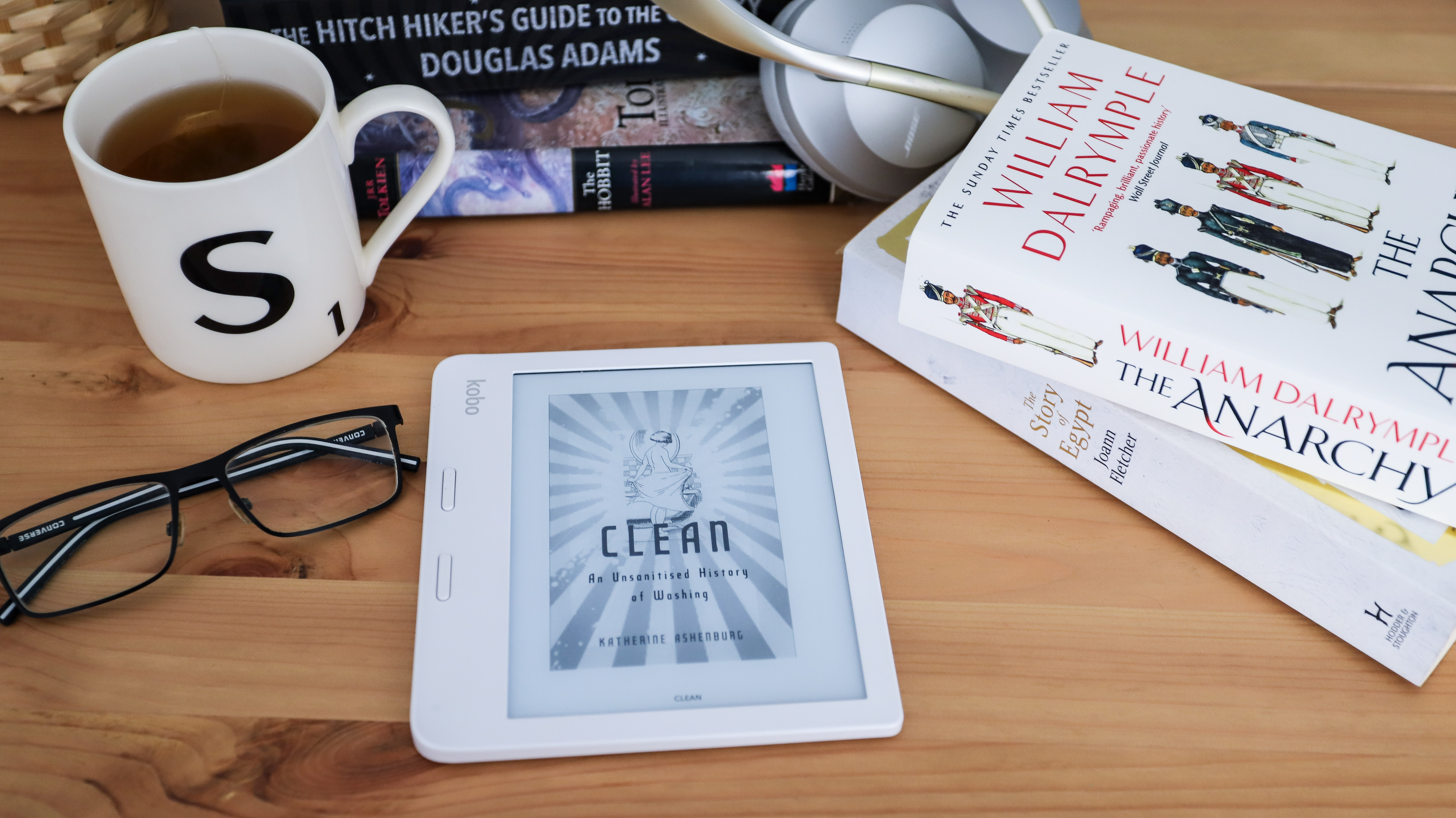 Kobo Libra 2 in white on a table with books