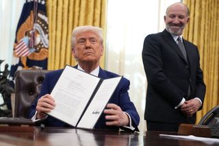 President Donald Trump, joined by Secretary of Commerce Howard Lutnick, delivers remarks after signing an executive order on reciprocal tariffs in the Oval Office at the White House