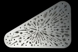 A rounded triangular plate with lots of wavelength designs.