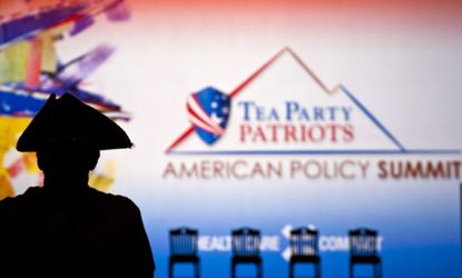 A shadowed patriot attends the 2011 Tea Party summit.