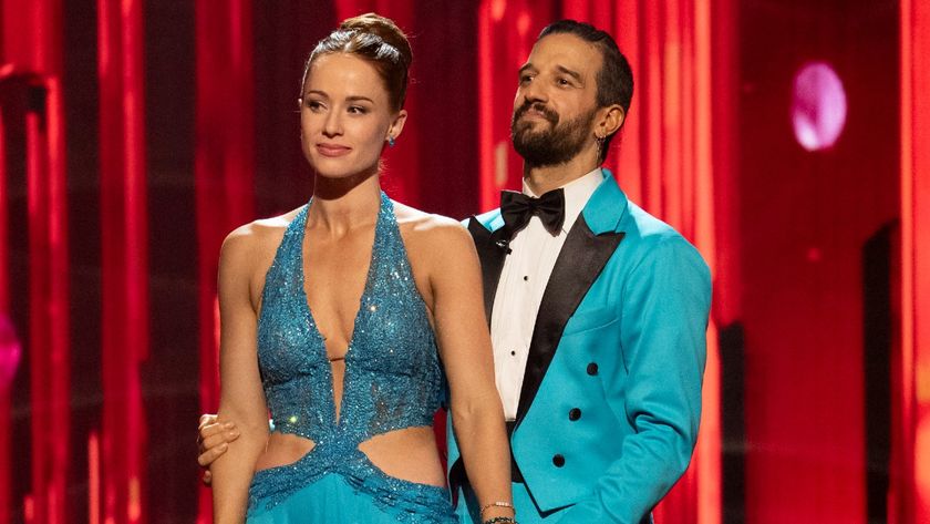Whitney Leavitt and Mark Ballas standing together during Dancing with the Stars. 
