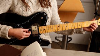 Woman playing guitar