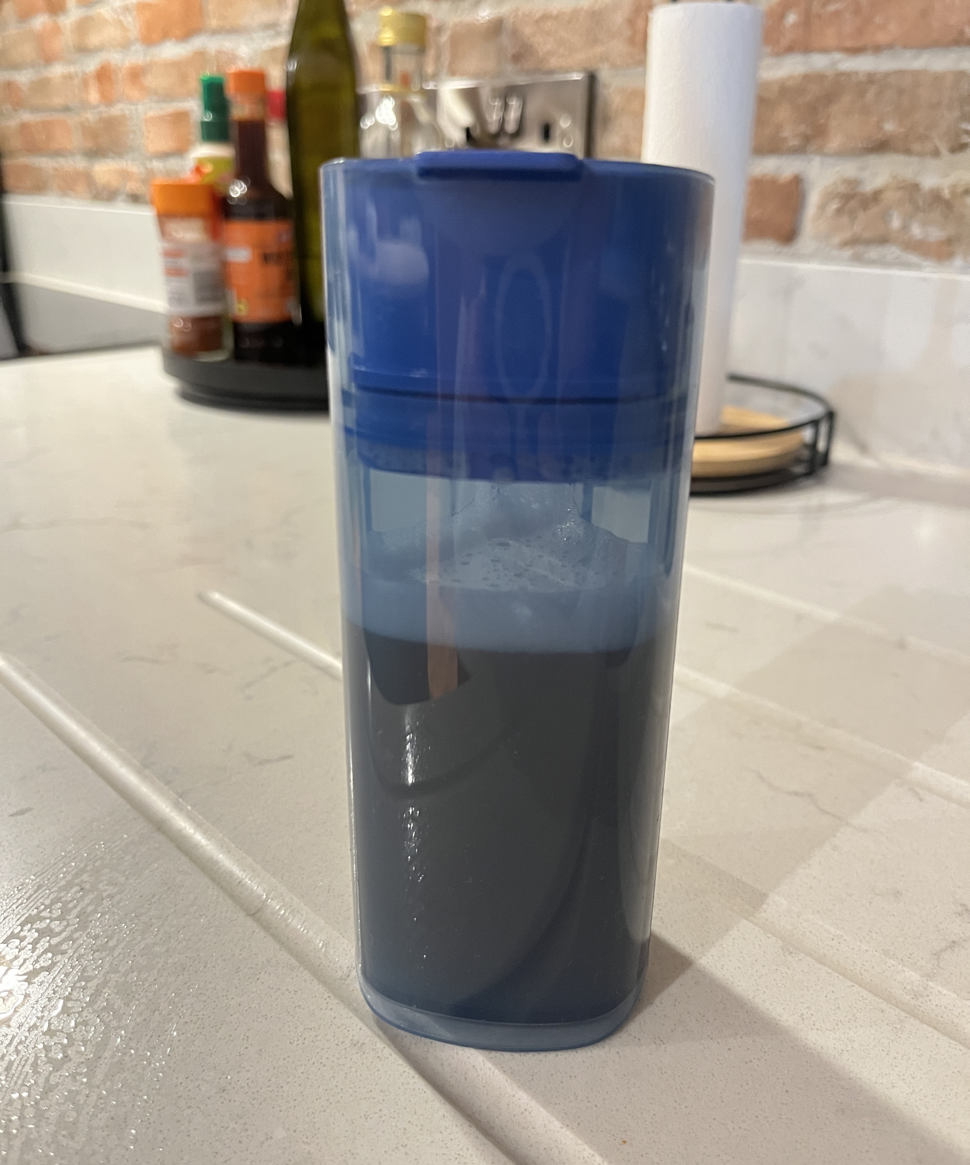 container of dirty water from the Philips OneUP 5000 series electric mop