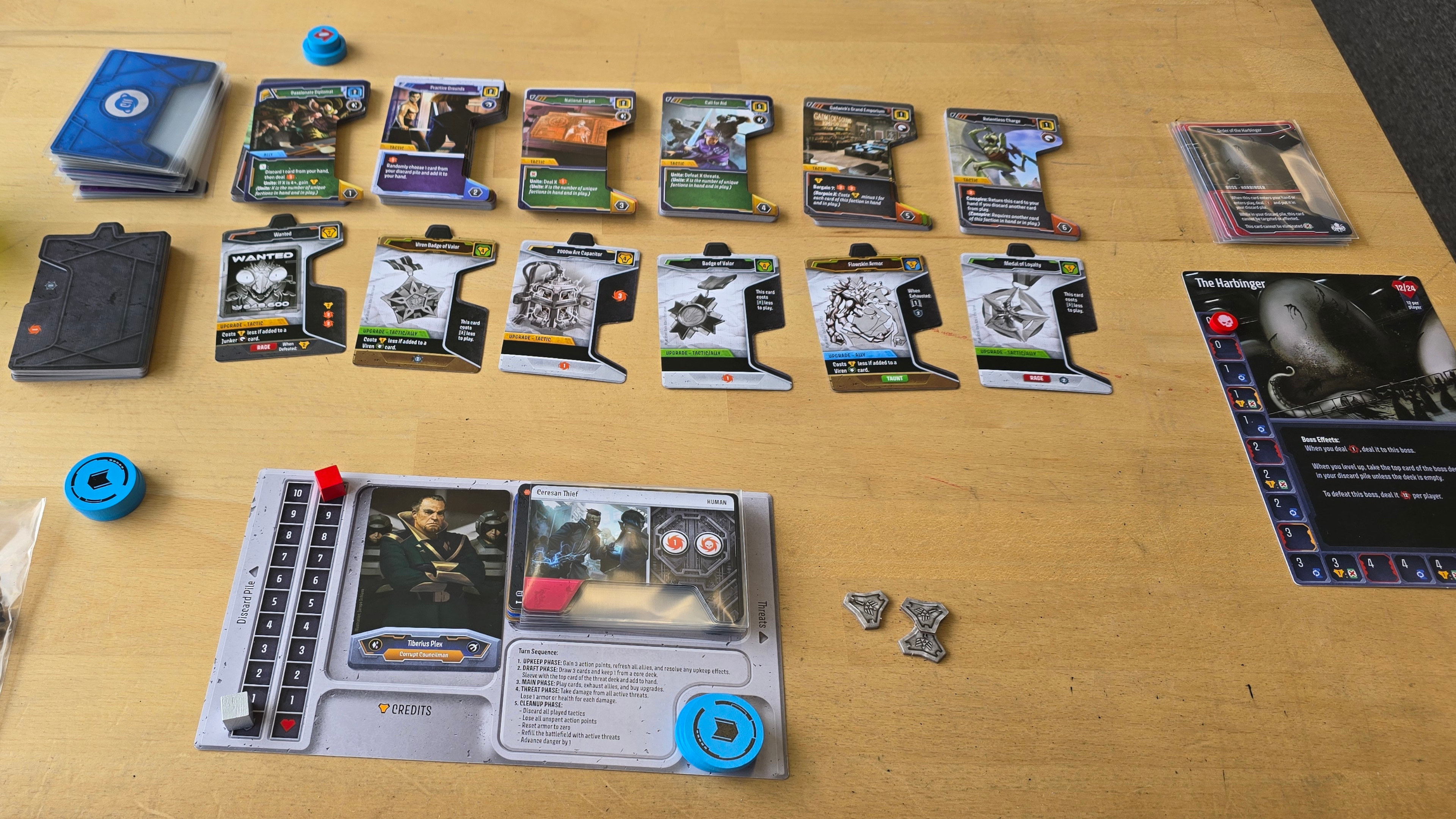 Unstoppable cards, components, and pieces laid out on a wooden surface