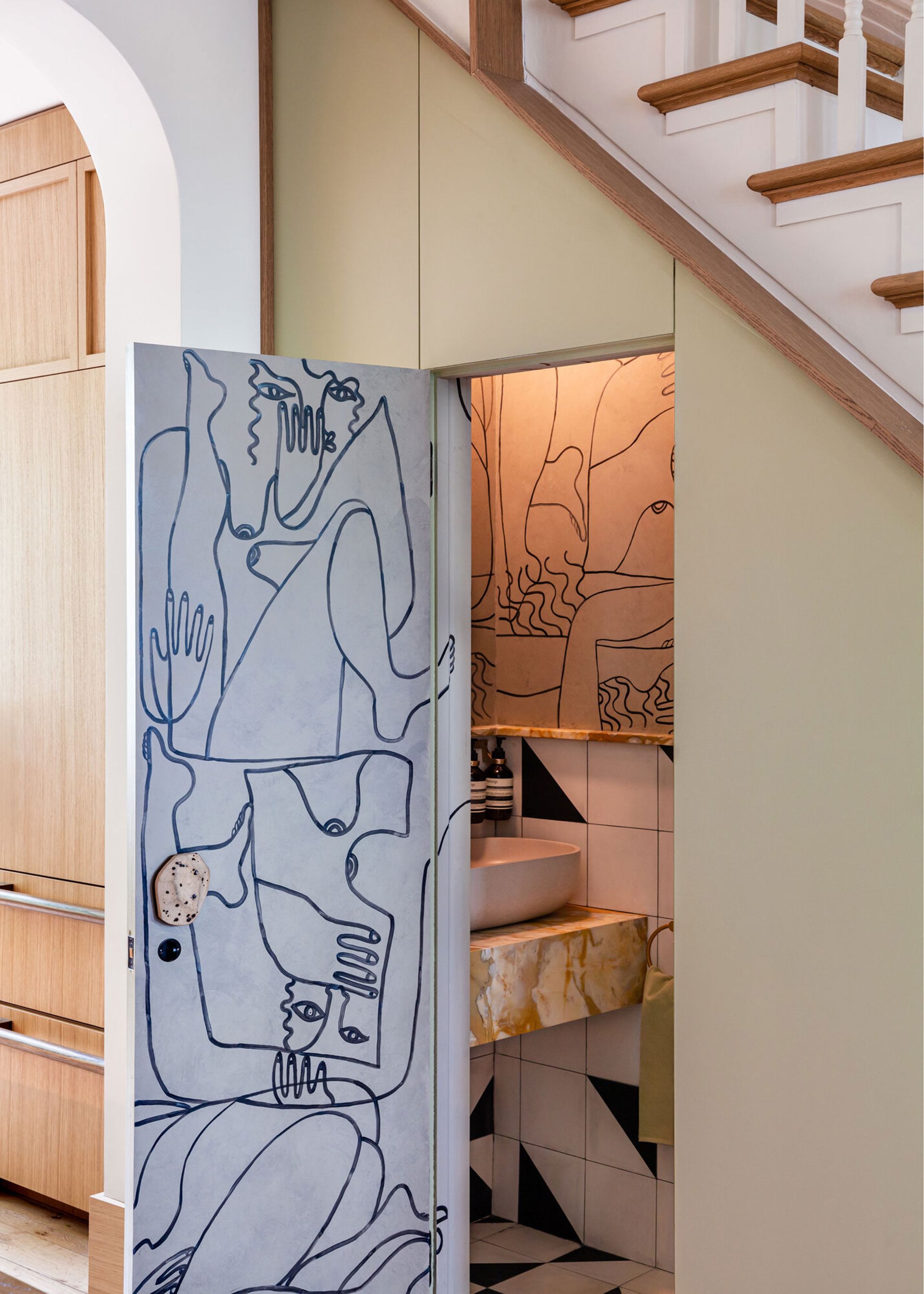 a small powder room with a wallpapered interior