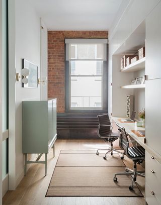 a small home office with a built-in desk