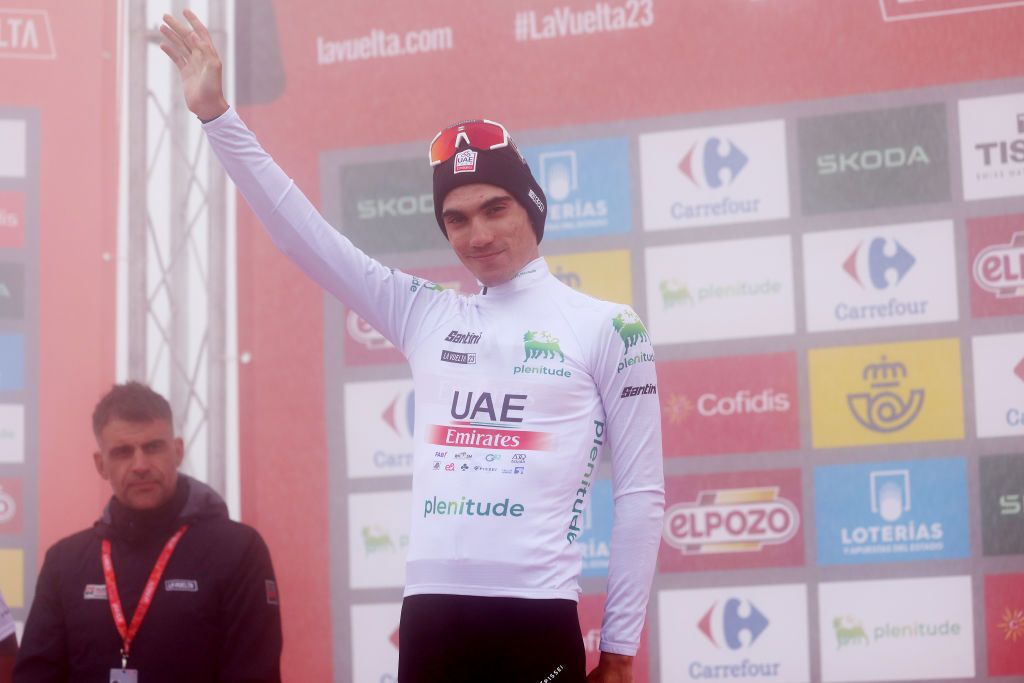 ALTU DE LANGLIRU SPAIN SEPTEMBER 13 Juan Ayuso of Spain and UAE Team Emirates White Best Young Rider Jersey celebrates at podium during the 78th Tour of Spain 2023 Stage 17 a 1244km stage from Ribadesella Ribeseya to Altu de LAngliru 1555m UCIWT on September 13 2023 in Altu de LAngliru Spain Photo by Alexander HassensteinGetty Images