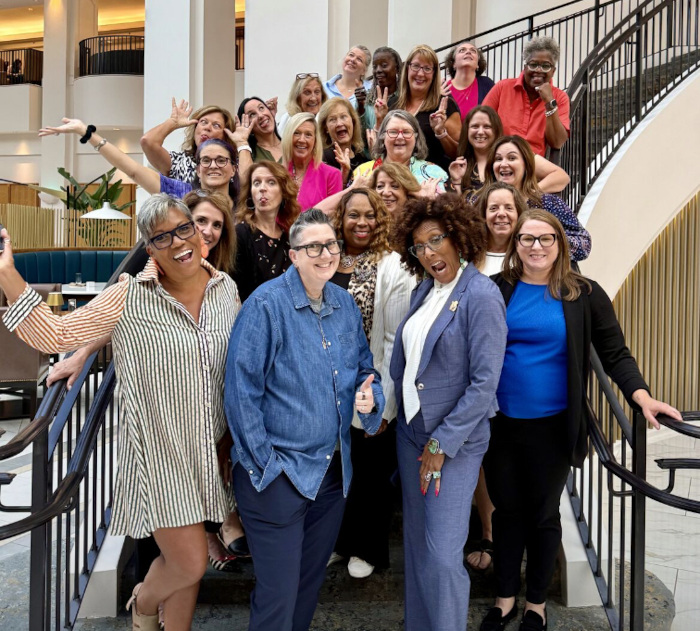 The DOLS gathered on the hotel’s staircase for a fun group photo.