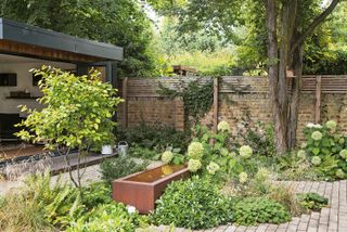 corten steel water feature in plot