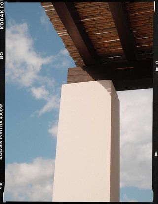 White pillar against a blue sky