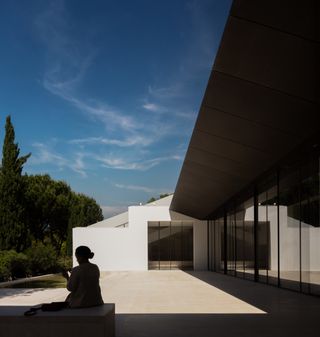 gulbenkian foundation's new art museum with swooping kengo kuma timber roof and quite greenery in Lisbon