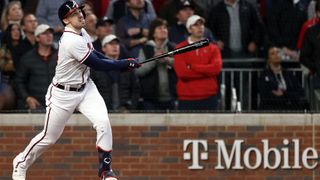 Adam Duvall #14 of the Atlanta Braves hits a grand slam home run against Framber Valdez (not pictured) of the Houston Astros during the first inning in Game Five of the World Series at Truist Park on Oct. 31, 2021 in Atlanta, Georgia.