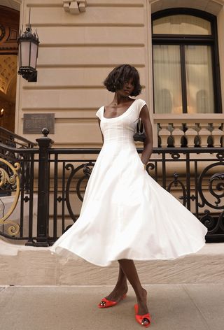 summer wardrobe essential shown on a woman wearing a white dress