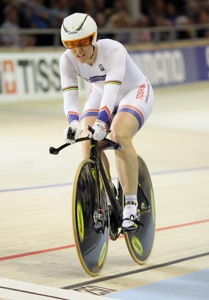 500m time trial gold medalist Anna Meares starts to celebrate as she goes fastest with one rider to go.