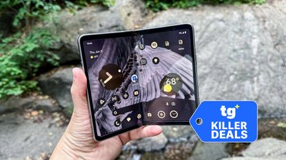 Pixel Fold held in the hand with badge nearby.