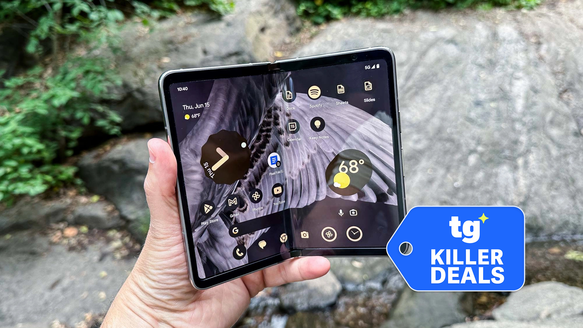 Pixel Fold held in the hand with badge nearby.