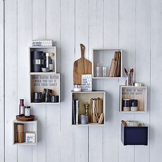white wooden wall with box shelves