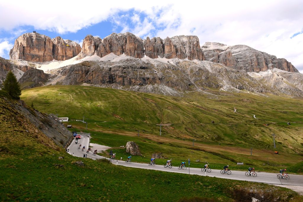 PASSO FEDAIA ITALY MAY 28 A general view of the Peloton passing through Arabba 1601m Italian Dolomites mountainous landscape during the 105th Giro dItalia 2022 Stage 20 a 168km stage from Belluno to Marmolada Passo Fedaia 2052m Giro WorldTour on May 28 2022 in Passo Fedaia Italy Photo by Tim de WaeleGetty Images