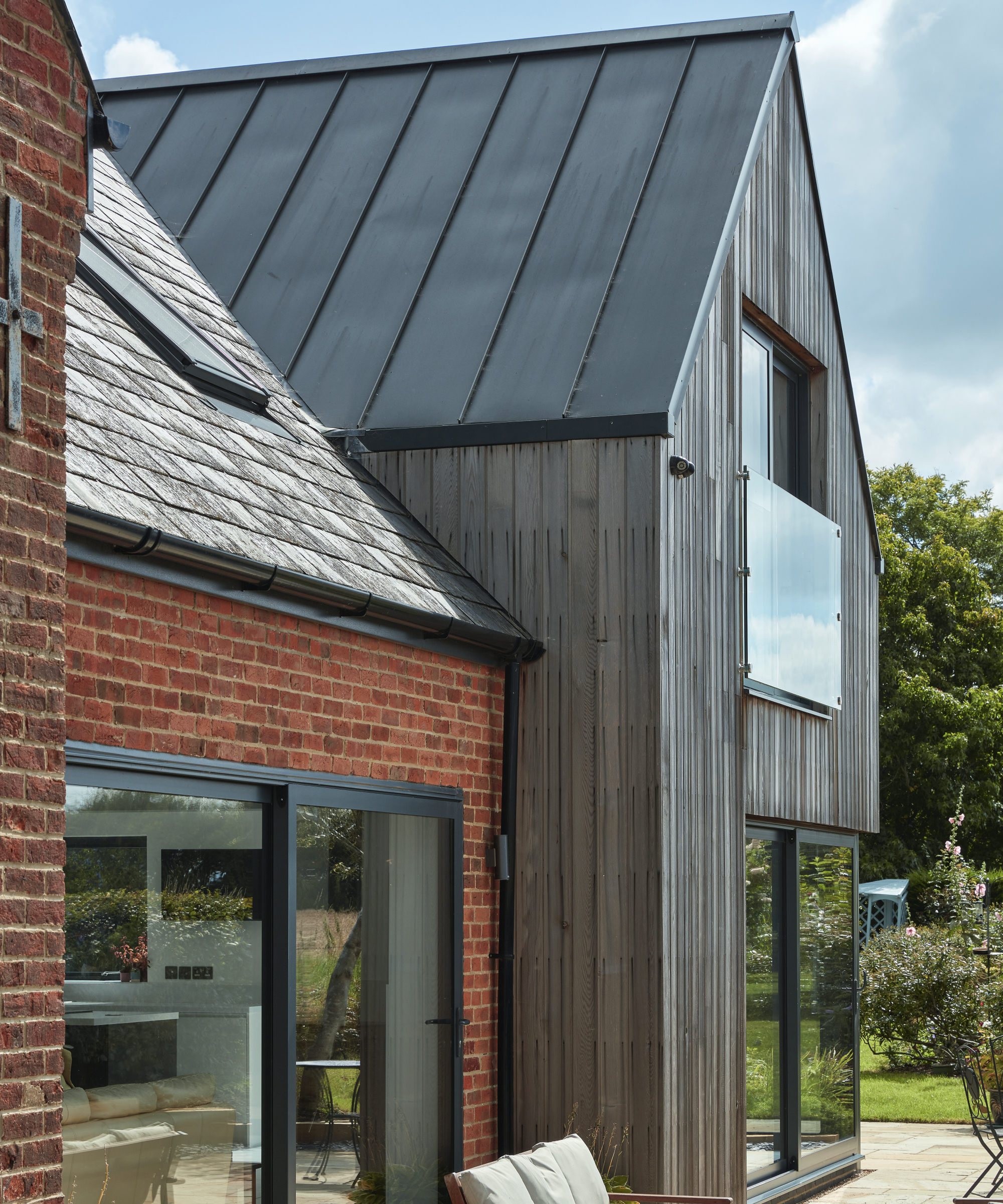 zinc pitched roof on timber clad extension