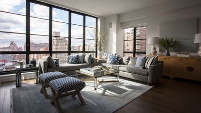 Open plan living room with large windows