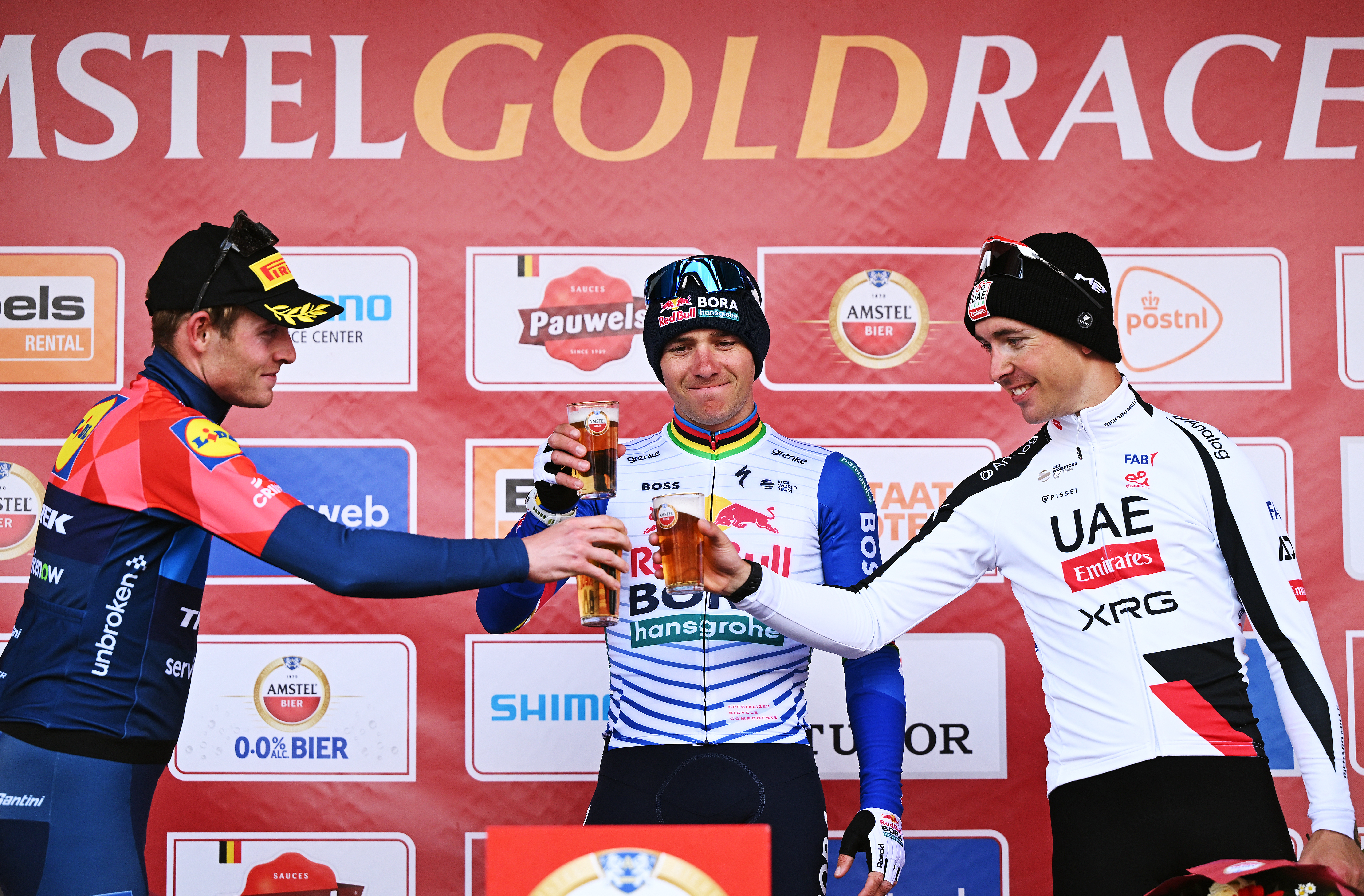 VALKENBURG, NETHERLANDS - APRIL 19: (L-R) Mattias Skjelmose of Denmark and Team Lidl - Trek on second place, race winner Remco Evenepoel of Belgium and Team Red Bull - BORA - hansgrohe and Benoit Cosnefroy of France and UAE Team Emirates - XRG on third place pose on the podium ceremony after the 60th Amstel Gold Race 2026 - Men&amp;amp;apos;s Elite a 257.2km one day race from Maastricht to Valkenburg / #UCIWT / on April 19, 2026 in Valkenburg, Netherlands. (Photo by Dario Belingheri/Getty Images)