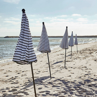 strip design umbrella on beach for shade