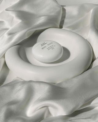 superegg vegan moisturiser on white silk background