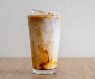 Iced coffee in a glass on a wooden table