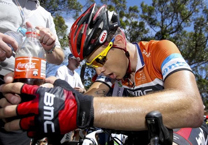 Martin Kohler seeks solace in a cold coke after losing the race leader's jersey