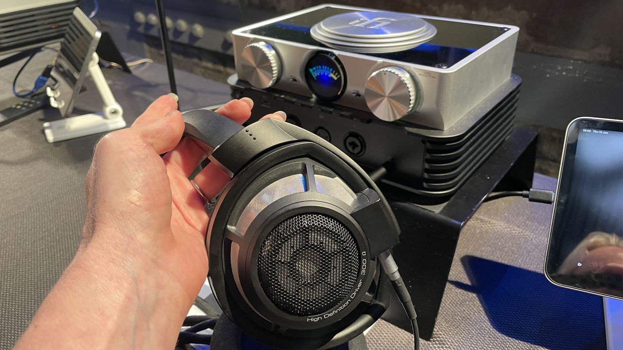 The formidable iFi iDSD Phantom in Tower Bridge, London, used with headphones and illuminating the front panel