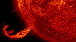 An eruption of highly magnetized plasma known as a coronal mass ejection.