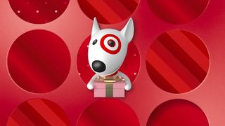 Black Friday deals Target white dog mascot holding a gift