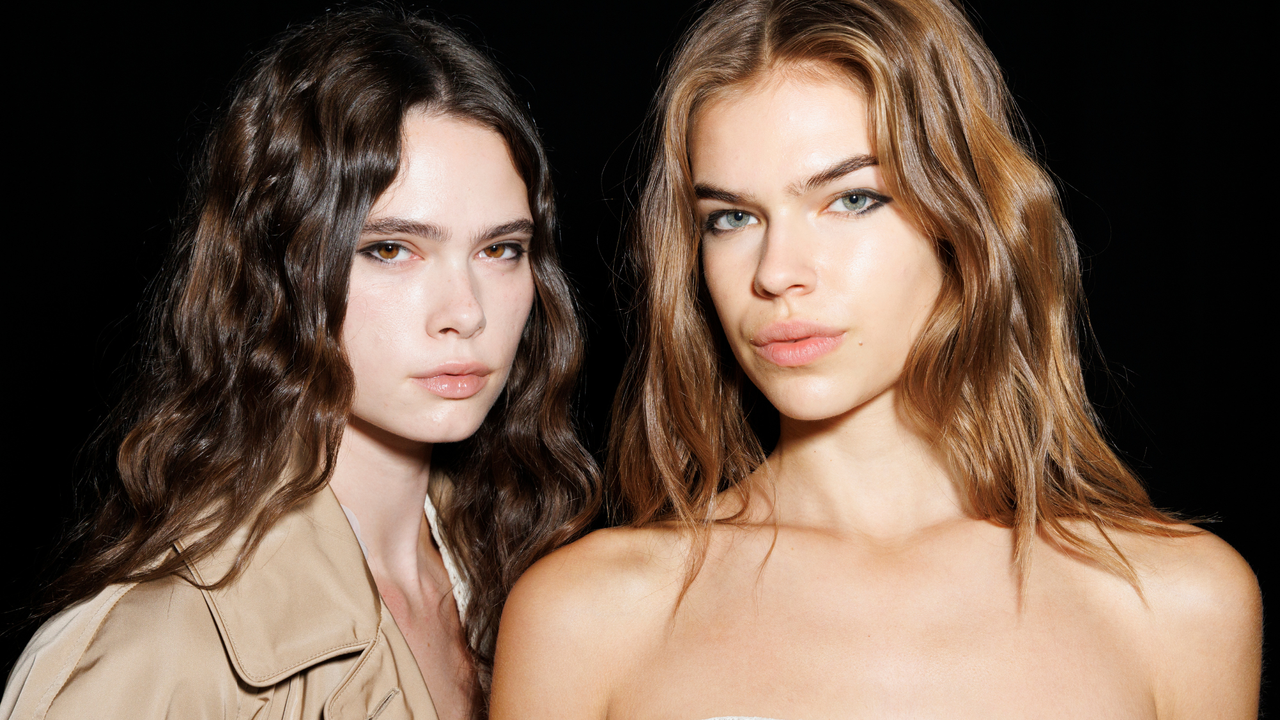 Two models with beautiful hydrated and naturally radiant skin showcasing satin skin