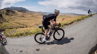 Tom Wieckowski climbing Harknott pass in the Lake District 