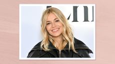 Sienna Miller smiling and wearing a black leather jacket with blonde curled hair and natural glowy makeup