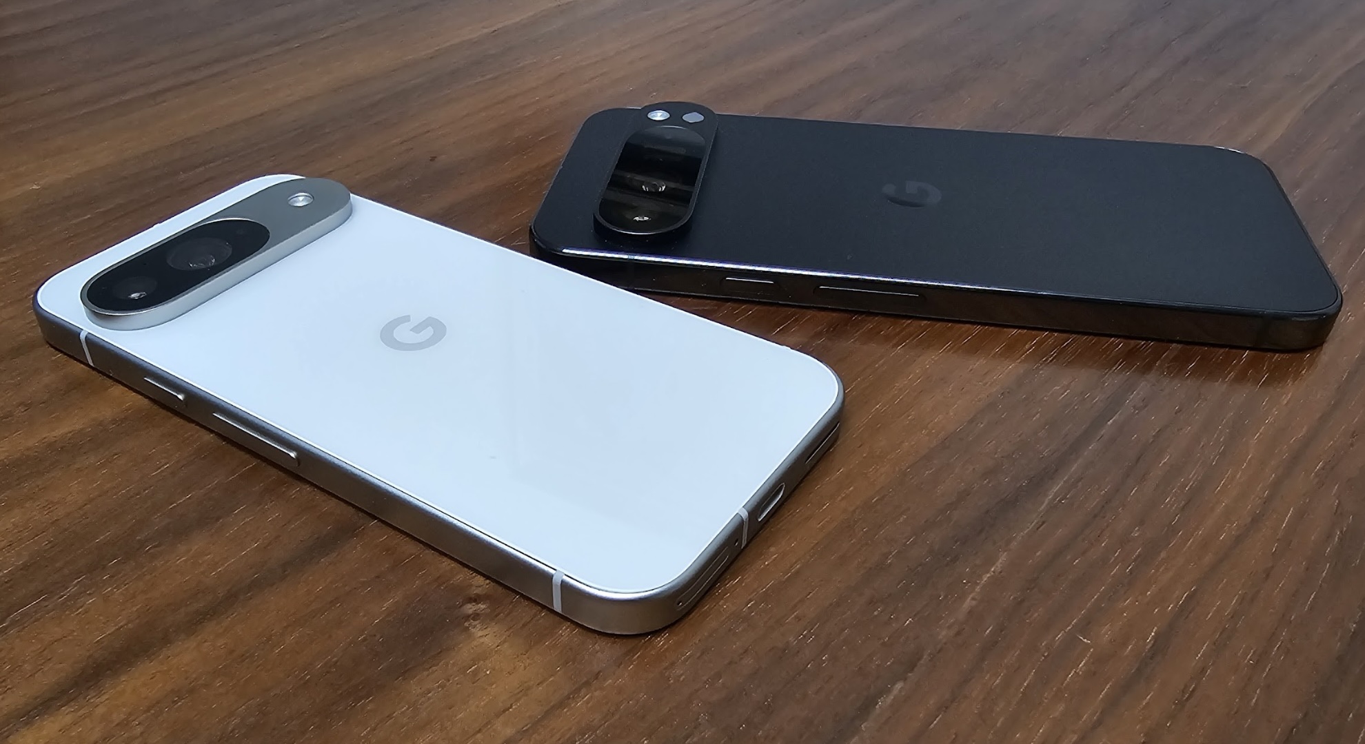 A Google Pixel 9 and Google Pixel 9 Pro XL on a table