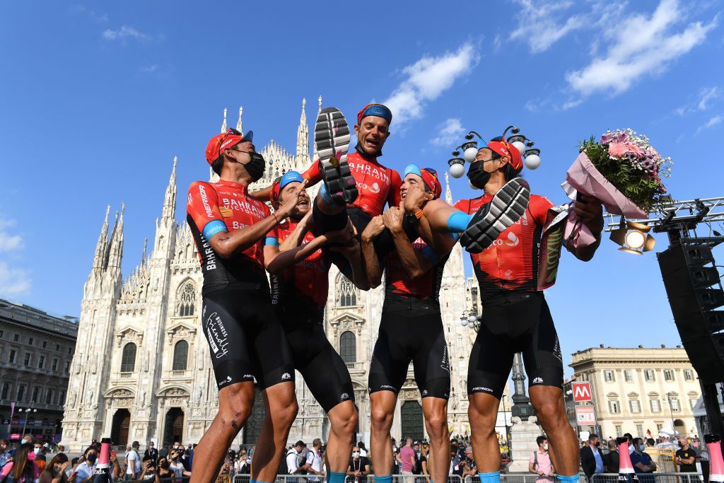 Bahrain Victorious teammates hoist Damiano Caruso after his second place in the Giro d&#039;Italia